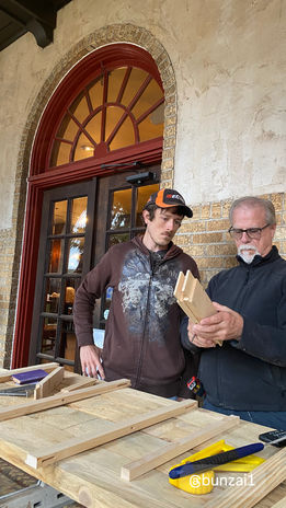 Craftsmen at an arched Opera House window