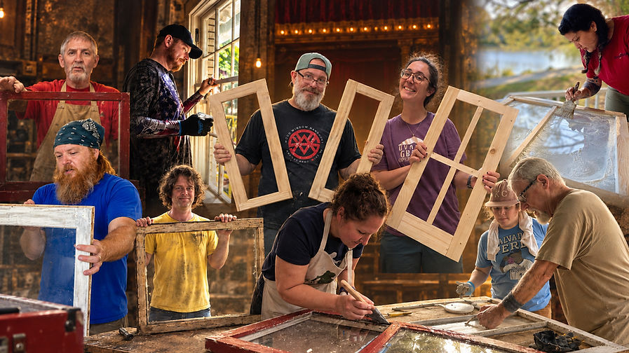 A team holding up finished sash frames